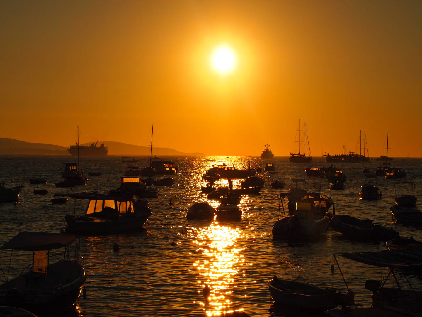 Enjoying a beautiful sunset in Croatia on a summer vacation together with friends.